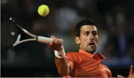  ?? ALESSANDRA TARANTINO — THE ASSOCIATED PRESS ?? Serbia's Novak Djokovic returns the ball to Norway's Casper Ruud during their semifinal match at the Italian Open in Rome on Saturday.