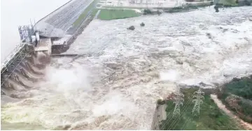  ??  ?? An aerial view shows flooding along Lake Lyndon B Johnson dam in Llano county, Texas in this still image from video obtained from social media. — Reuters photo