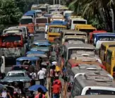  ?? LYN RILLON ?? TRAFFIC bottleneck­s common in Metro Manila like this would be common sights, too, in Quezon and other provinces when the annual Holy Week trek of millions of people starts.