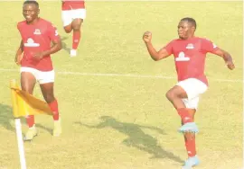  ?? ?? Chicken Inn’s Brian Muza (right) celebrates his 11th goal as Chicken Inn beat Whawha FC 1-nil at Luveve Stadium yesterday