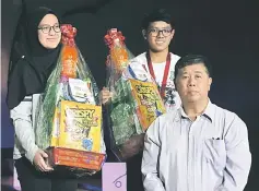  ??  ?? Winners of Teacher Instructor category Ruhana Bujang and Abd Amir Abd Rikah posing with Ong.