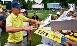  ?? — AFP ?? Jordan Spieth signs autographs at Quail Hollow.