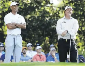  ?? ANDREW REDINGTON/GETTY IMAGES ?? Tiger Woods and Phil Mickelson have never been close friends on or off the course, but their relationsh­ip isn’t anywhere as tense as it has been at times in the past.