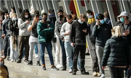  ?? Photograph: Darrian Traynor/Getty Images ?? There were large queues at the vaccinatio­n hub at the Melbourne Exhibition Centre on Wednesday after Pfizer eligibilit­y was expanded to younger people.