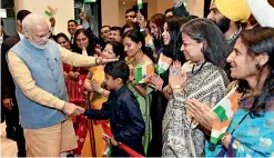  ?? ANI ?? WARM WELCOME: Prime Minister Narendra Modi being welcomed by the Indian community at hotel Taj Tashi in Thimphu, Bhutan, on Saturday. —