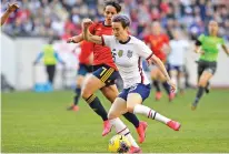  ?? BILL KOSTROUN/ASSOCIATED PRESS ?? United States forward Megan Rapinoe controls the ball as she is pursued by Spain defender Marta Corredera during the first half of a SheBelieve­s Cup match Sunday in Harrison, N.J.