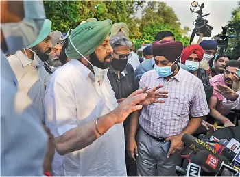  ?? - PTI ?? Captain Amarinder Singh speaks to the media after submitting his resignatio­n to Governor Purohit Banwarilal at Raj Bhavan in Chandigarh on Saturday.
