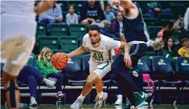  ?? WSU ATHLETICS ?? Kaden Brown, a true freshman called upon with Wright State plagued by illness and foul trouble, helped beat Cleveland State on Thursday with 17 strong minutes.