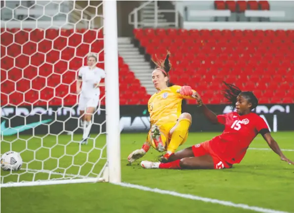  ?? — REUTERS ?? Nichelle Prince scores Canada's second goal versus England during a women's internatio­nal friendly match Tuesday at bet365 Stadium at Stoke-on-Trent, England. Canada's 2-0 victory showcased a wealth of talent that will make Olympic team selection difficult.