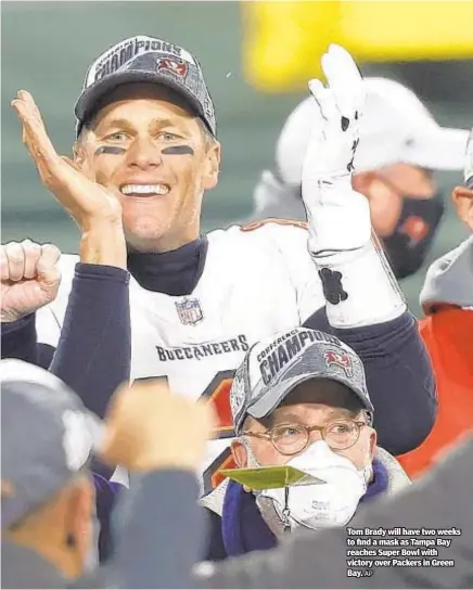  ??  ?? Tom Brady will have two weeks to find a mask as Tampa Bay reaches Super Bowl with victory over Packers in Green Bay.