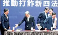  ?? PHOTO: WANG YI-SUNG, TAIPEI TIMES ?? Premier Chen Chien-jen, second left, gestures to Minister Without Portfolio Lo Pingcheng, left, at a news conference in Taipei yesterday.