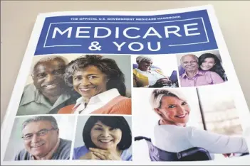  ?? AP PHOTO/PABLO MARTINEZ MONSIVAIS ?? THE U.S. MEDICARE HANDBOOK is photograph­ed in Washington in this 2018 photo.