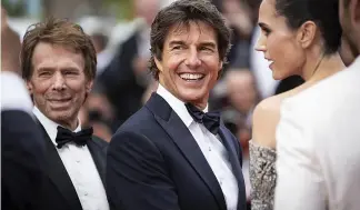  ?? ?? Tom Cruise poses for photograph­ers upon arrival at the premiere of the film 'Top Gun: Maverick' at the 75th internatio­nal film festival, Cannes, southern France, Wednesday, Ma