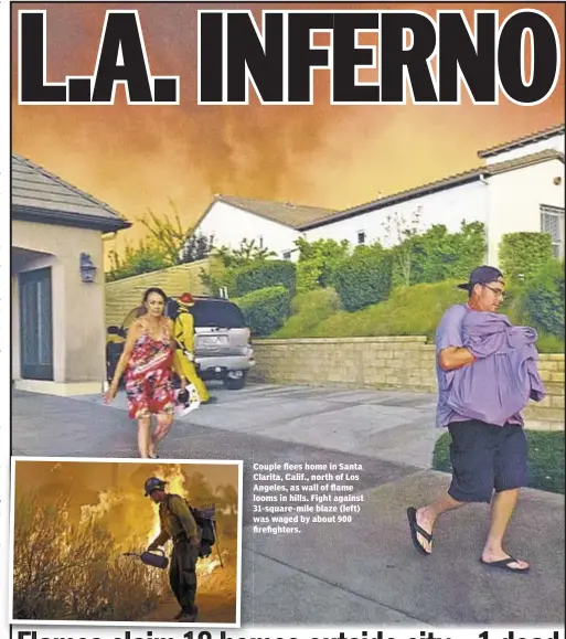  ??  ?? Couple flees home in Santa Clarita, Calif., north of Los Angeles, as wall of flame looms in hills. Fight against 31-square-mile blaze (left) was waged by about 900 firefighte­rs.