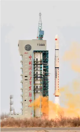  ?? XINHUA ?? LONG March-4C rocket carrying the third group of China’s Yaogan-31 remote sensing satellites blasts off from the Jiuquan Satellite Launch Center in northwest China on Wednesday.