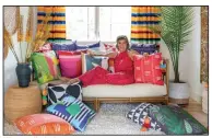  ?? (Photo courtesy of Spacecraft­ing) ?? Minneapoli­s designer Lucy Penfield at home with her colorful collection of new pillows for Missio Home.