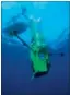 ?? Photos: REUTERS ?? Vertical torpedo: The Deepsea Challenger begins a test dive.