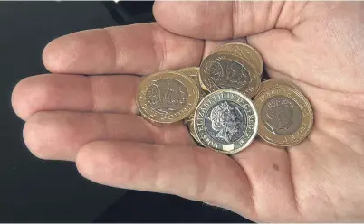  ?? Picture: PA. ?? The new 12-sided £1 coin began to enter circulatio­n last Wednesday.