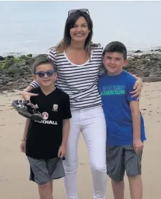  ??  ?? Irfon Williams’ widow, Rebecca Williams, with her two sons Siôn, eight, and Ianto, six
