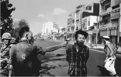  ?? EDDIE ADAMS/COURTESY MONROE GALLERY OF PHOTOGRAPH­Y ?? Street Execution of a Viet-Cong Prisoner, Saigon, Feb. 1, 1968.