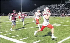  ?? TERRY, THE OKLAHOMAN] [PHOTO BY BRYAN ?? Yukon’s Parker Kenley runs to the end zone for a touchdown against Edmond Memorial during Friday’s football game at Edmond Santa Fe High School in Edmond.