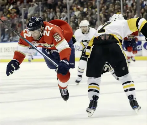  ?? Associated Press photos ?? Matt Cullen knocks Florida’s Troy Brouwer off his skates in the second period Thursday night in Sunrise, Fla.