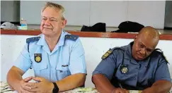  ?? ?? LEADERSHIP: Captain Tommie Parkinson, station commander at the Kenton-on-sea police station, and Ndlambe Victim Empowermen­t Forum chair Sergeant Vunyelwa Titi attend the meeting.