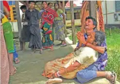  ??  ?? BANGLADESH: Relatives mourn for members of their family, whom they believe were killed by Rohingya militants, at Maungdaw hospital.—AFP