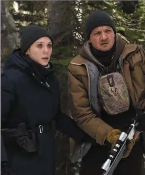  ??  ?? Elizabeth Olsen and Jeremy Renner in WindRiver.