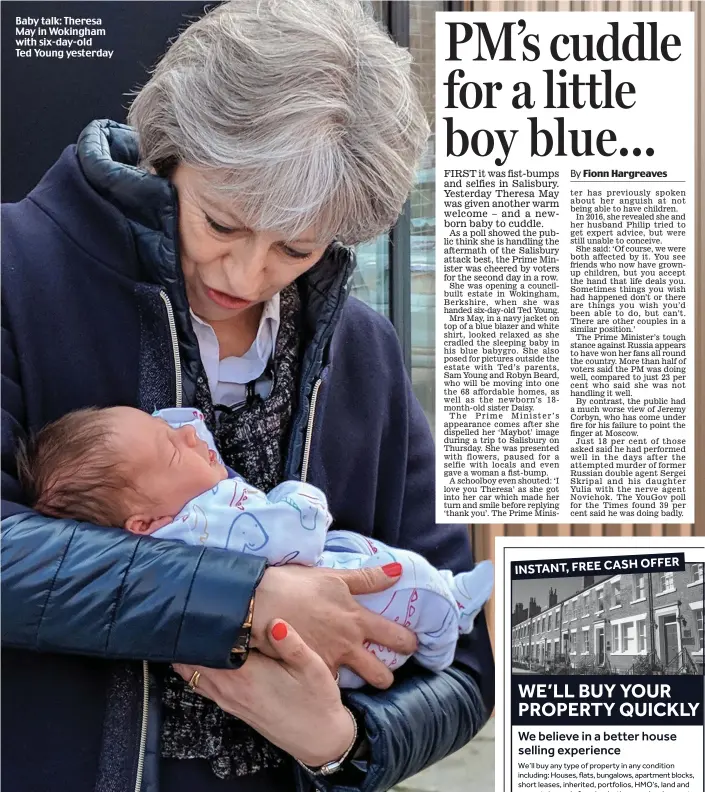  ??  ?? Baby talk: Theresa May in Wokingham with six-day-old Ted Young yesterday