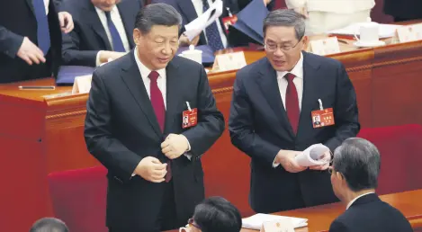  ?? ?? Chinese President Xi Jinping (L) and Premier Li Qiang (R) during the opening ceremony of the second session of the 14th National People’s Congress of China in Beijing, China, March 5, 2024.