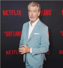  ?? AP PHOTO/CHRIS PIZZELLO ?? Pierce Brosnan, a cast member in “The Out-Laws,” poses at a special screening of the film June 26 at the Regal LA Live theaters in Los Angeles.