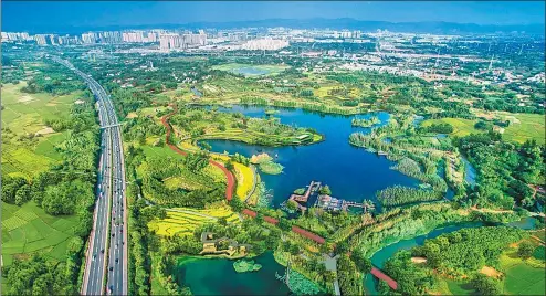  ?? PHOTOS PROVIDED TO CHINA DAILY ?? Clockwise from top left: The Tianfu Greenway has become a popular oasis in the city for Chengdu residents. The Tianfu Hibiscus Garden along the greenway boasts a diverse variety of flowers. The lush trees, flowers, rivers and lakes which take pride of...