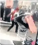  ??  ?? AN EFF member vandalisin­g an H&M store at the weekend.