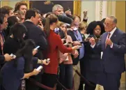  ?? STEVE HELBER — THE ASSOCIATED PRESS ?? Senate Minority Leader Chuck Schumer, D-N.Y., right, talks to the media as he returns to the Senate chamber for the impeachmen­t trial of President Donald Trump at the U.S. Capitol on Friday, Jan 31, in Washington.