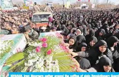  ??  ?? ISFAHAN, Iran: Mourners gather around the coffins of slain Revolution­ary Guards during their funeral yesterday. — AFP