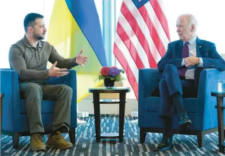  ?? SUSAN WALSH/AP ?? President Joe Biden, right, meets with Ukrainian President Volodymyr Zelenskyy on Sunday in Japan.