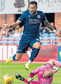  ?? Pictures: SNS Group. ?? Far left: New Dundee loan signing Josh McPake tries his luck at goal; left: Shaun Byrne wins the ball in midfield; above: Kane Hemmings is denied by Mark Ridgers.