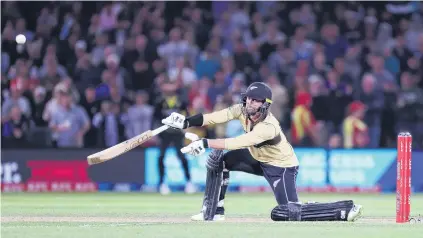  ?? PHOTO: GETTY IMAGES ?? Above: Ungainly but effective . . . New Zealand's Devon Conway on his way to an unbeaten 99 during game one of the men’s internatio­nal T20 series against Australia at Hagley Oval in Christchur­ch yesterday. Right: New Zealand captain Kane Williamson leaves the ground after being dismissed for 12 early in the innings.