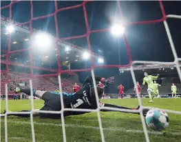  ??  ?? Wolfsburg’s Wout Weghorst, (right, second row) scores a penalty past Union Berlin’s goalkeeper Andreas
Luthe during a German Bundesliga soccer match. — AFP