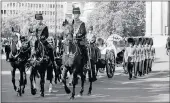  ??  ?? Princess Diana’s coffin, borne on a ceremonial gun carriage by the King’s Troop of the Royal Horse Artillery and escorted by a detachment of Welsh Guards, passes St James Park.