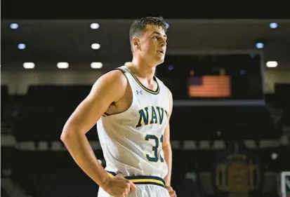  ?? TERRANCE WILLIAMS/FOR BALTIMORE SUN MEDIA ?? Navy forward Daniel Deaver, shown in this file photo, had a career-game Saturday with 35 points and 16 rebounds in a win over Holy Cross.