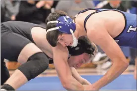  ?? Scott Herpst ?? Ringgold’s Hudson Moss locks up with Ridgeland’s Evan Doyal during a bout this past Tuesday in Ringgold.