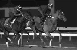  ?? BARBARA D. LIVINGSTON ?? Ten Gauge (left) works with Society last October at Keeneland. Ten Gauge is among the favorites in Friday’s Oaklawn feature.