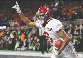  ?? The Associated Press ?? NO. 1: Alabama receiver DeVonta Smith celebrates his game-winning touchdown reception in overtime of the College Football Playoff championsh­ip game on Jan. 8 against Georgia in Atlanta.