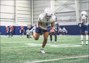  ?? Brendan Hill / UConn / Contribute­d photo ?? UConn receiver Keelan Marion participat­es in practice Thursday.