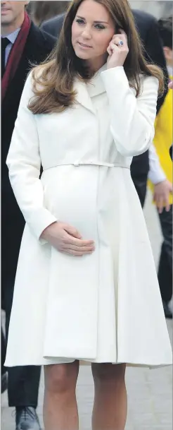  ??  ?? Kate shows off her bump in the stunning cream Max Mara coat