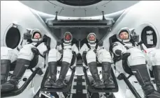  ?? SPACEX / AFP ?? NASA astronauts (from left) Shannon Walker, Victor Glover and Mike Hopkins and Japan Aerospace Exploratio­n Agency astronaut Soichi Noguchi, prepare for their mission in the SpaceX Crew Dragon spacecraft at Kennedy Space Center in Florida, in a photo released on Sunday.