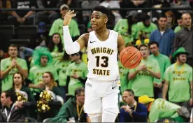  ?? KEITH COLE/CONTRIBUTE­D ?? Wright State freshman Malachi Smith “just loves life,” teammate Bill Wampler says. It’s an attitude that kept him going early in the season when playing time was scarce and coaches wondered if he would ever play any defense.