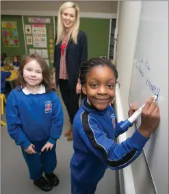  ??  ?? Rhianha Atkinson and Kimberly Anago are all smiles at the opening day with their teacher Stephanie Mulcahy.